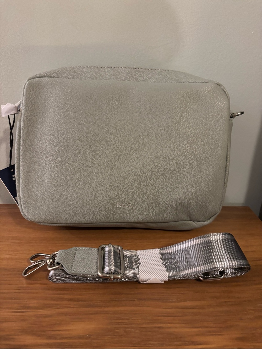 IZOD sage green crossbody bag pebbled faux leather finish an adjustable strap